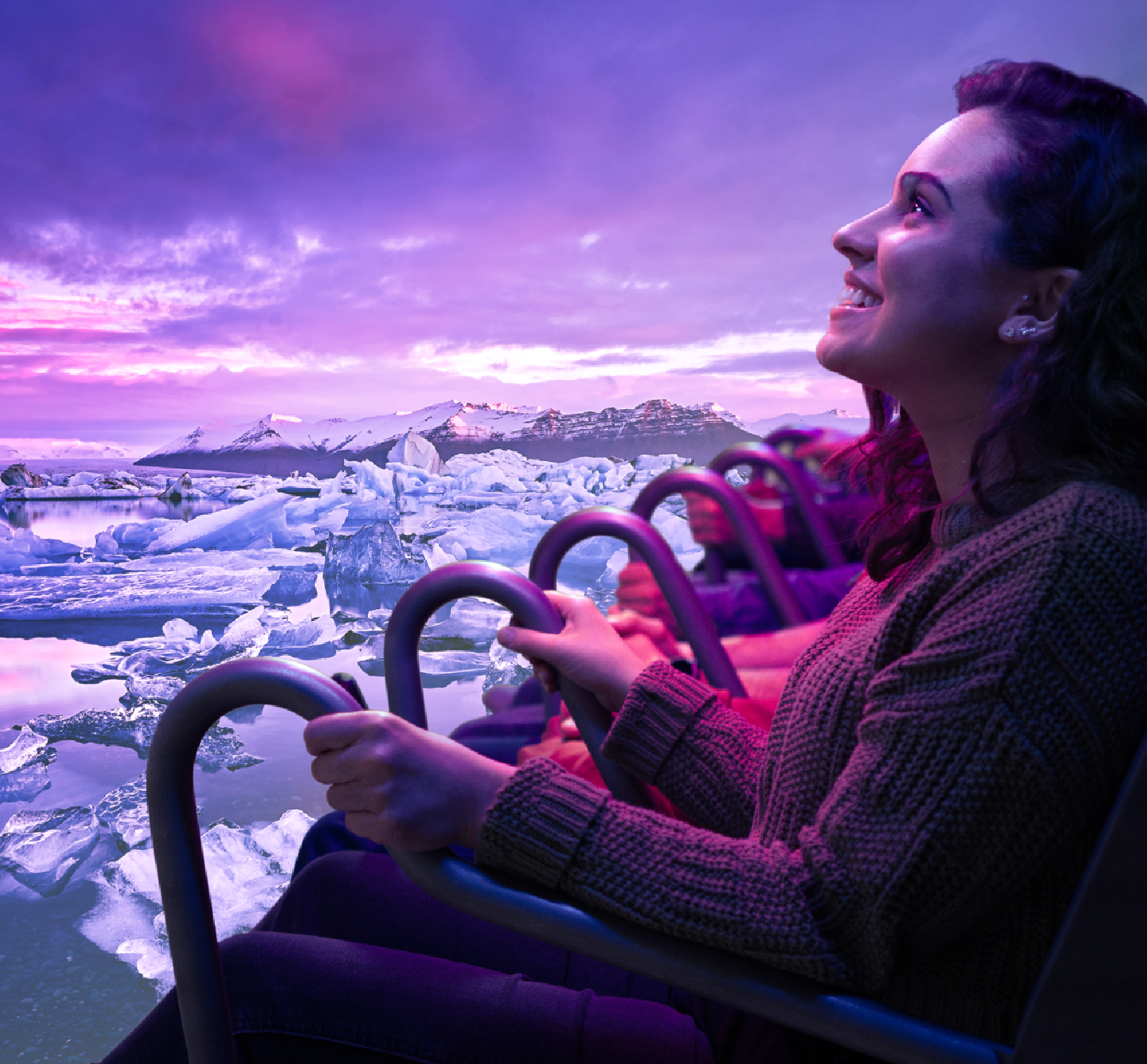 View of guest on FlyOver ride shows spherical screen and legs hanging from chairs